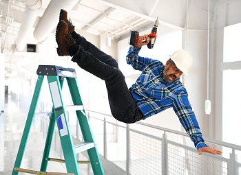 man wearing a hard hat and holding a drill falling off of a ladder